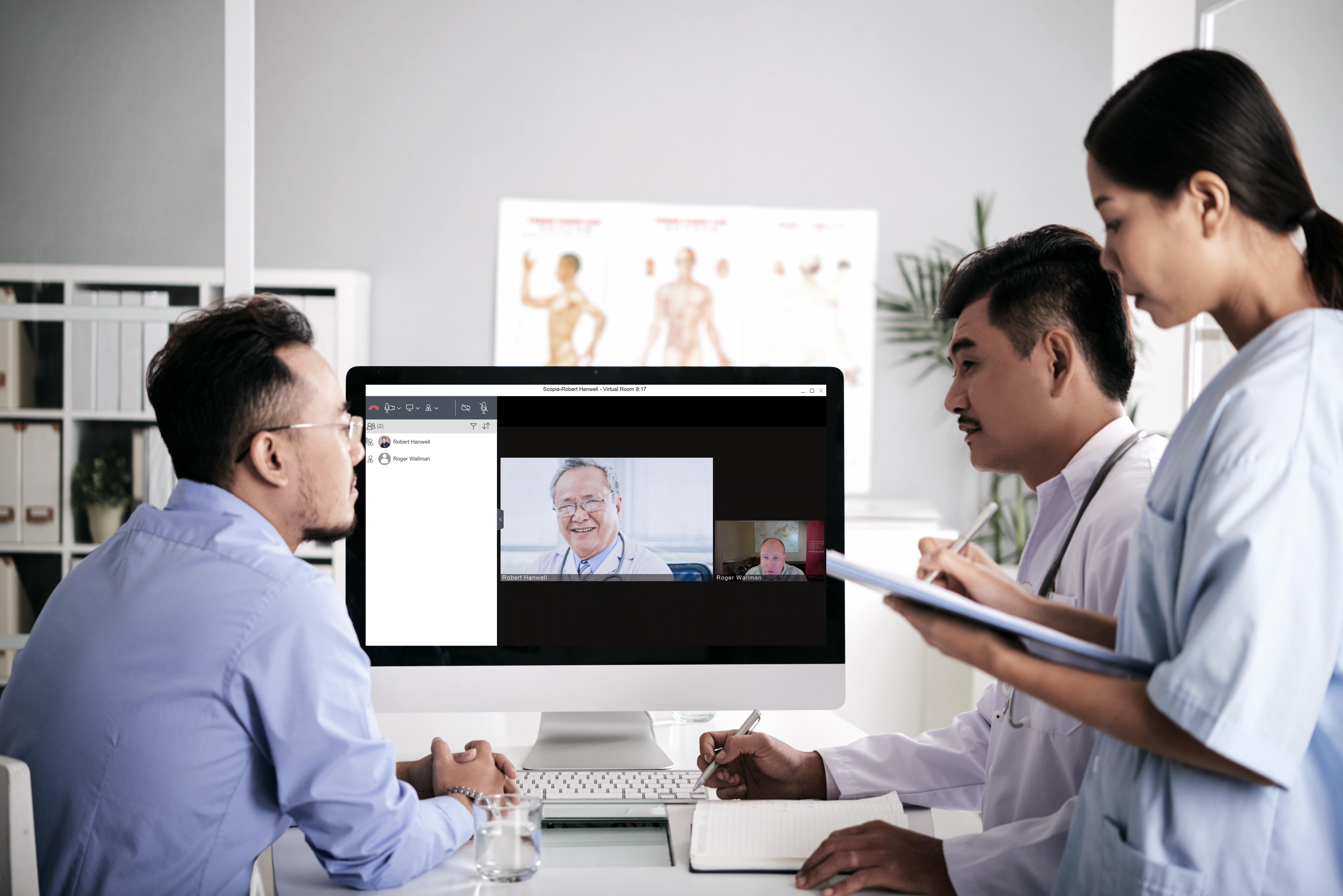 Asian medical interns consullting with doctor online