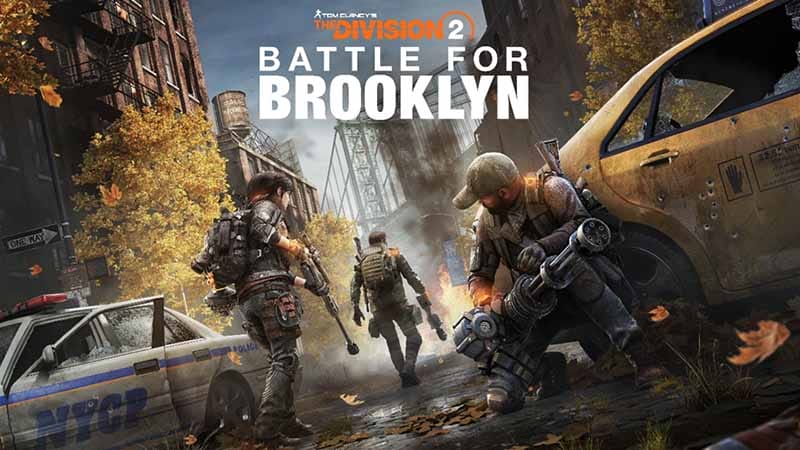 Imagen promocional del DLC 'Battle for Brooklyn' de The Division 2, mostrando personajes en un entorno urbano postapocalíptico con hojas caídas y vehículos abandonados.
